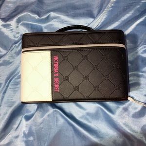 This is a victorious secret makeup bag with a zipper.
